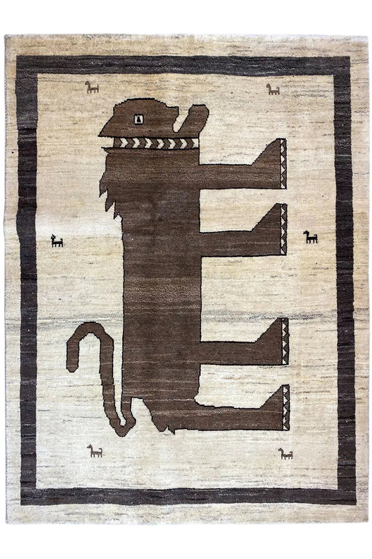 Gabbeh rug with a geometric animal/arrow pattern, light beige and dark brown, framed