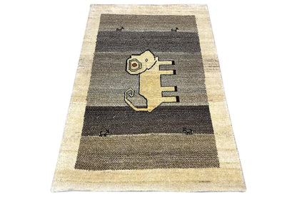 Gabbeh rug with a central lion motif and stripes in gray and beige