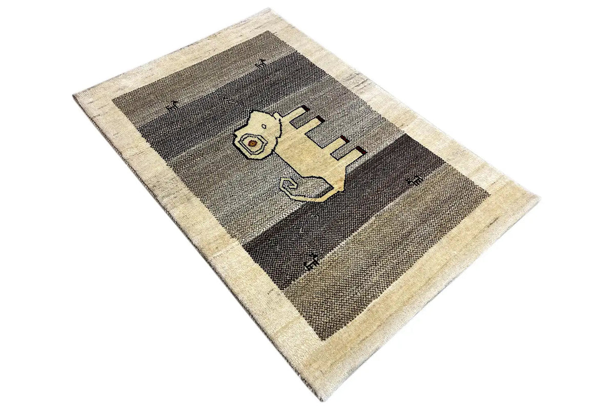 Gabbeh rug at a diagonal with a lion motif between gray stripes
