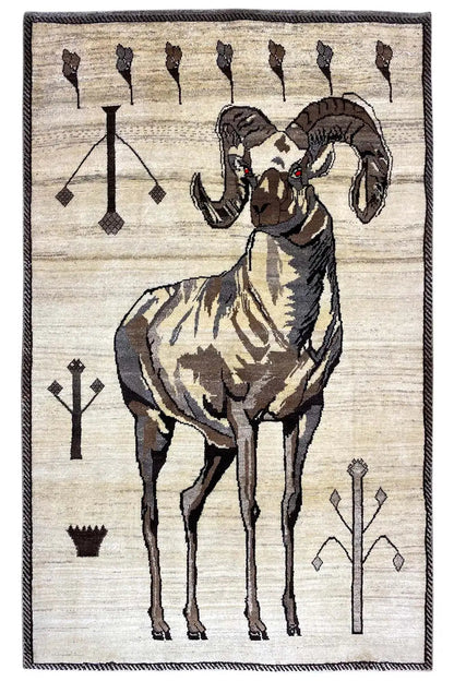 Gabbeh rug with lion’s head and figure, cream-colored, black and brown decorative motifs, framed border