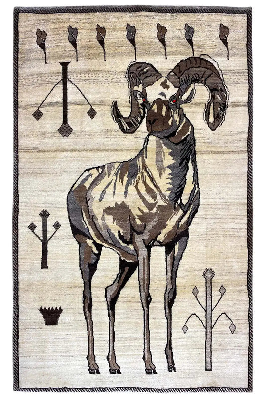 Gabbeh rug with lion’s head and figure, cream-colored, black and brown decorative motifs, framed border