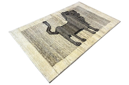 Gabbeh rug with lion motif, light beige background and dark graphite design