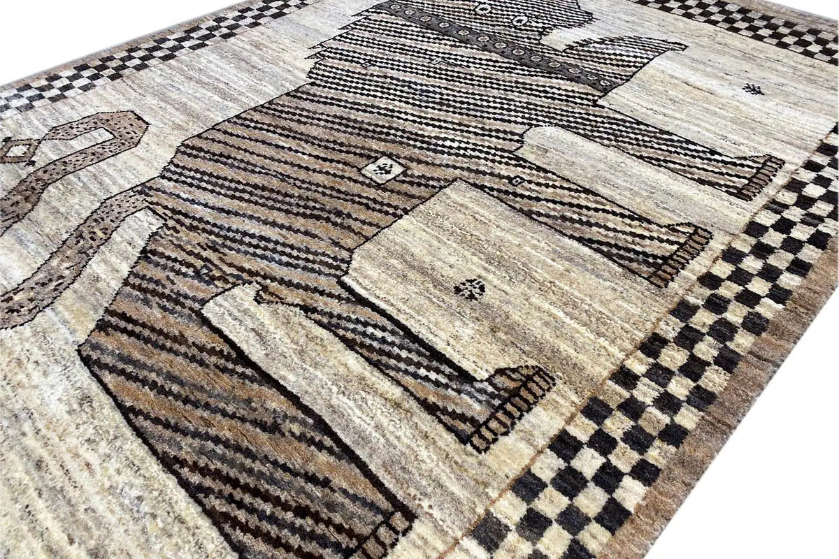 Close-up of a Gabbeh rug with a high-contrast animal motif, dashed lines, and a checked pattern