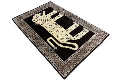 Rectangular oriental rug with a lion motif, dark with beige fields and an edge border