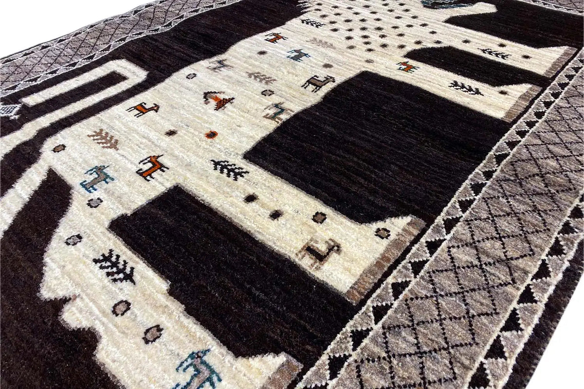 Close-up of the Oriental rug with a lion motif, dark areas and beige ornamental sections