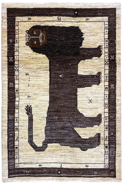 Rectangular Gabbeh rug with a dark figure and geometric border