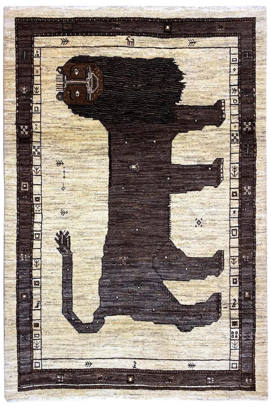 Rectangular Gabbeh rug with a dark figure and geometric border