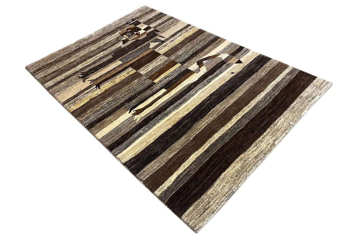 Gabbeh rug in diagonal view: striped pattern with a lion motif in brown/beige.