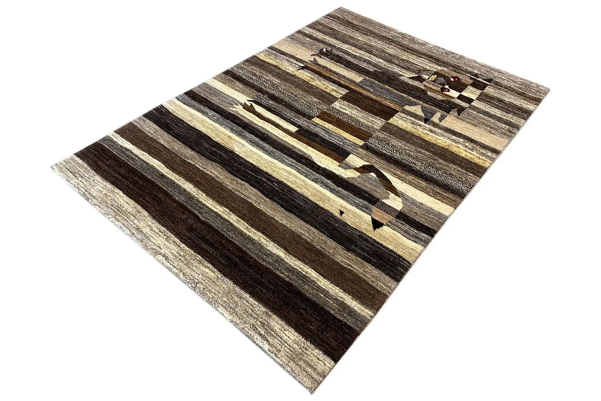 Gabbeh rug, photographed diagonally, with striped pattern and lion motif at the top.