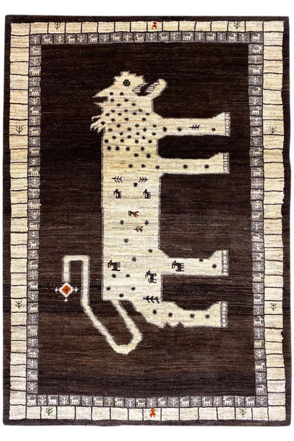 Rectangular Gabbeh rug with a large lion motif, dark field, and beige border