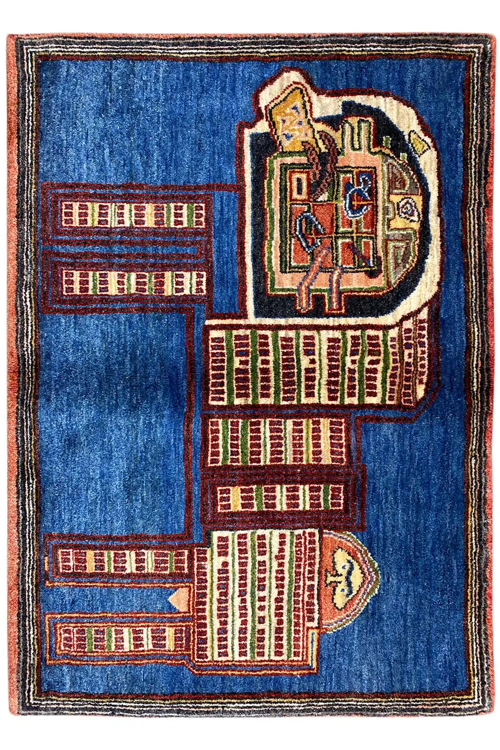 Blue Gabbeh rug with a red and beige pattern of buildings and a lion's head, rectangular