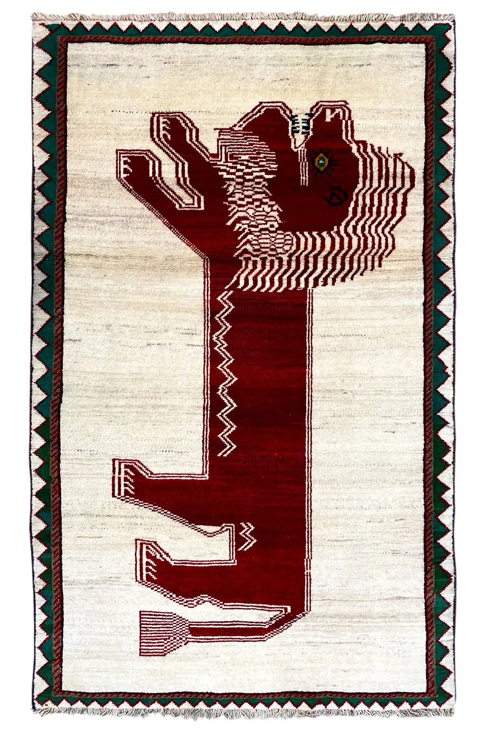 Gabbeh rug with a beige background, red motif, and green decorative border