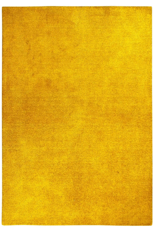 Mustard-yellow gabbeh rug, front view of the rectangular surface, with no discernible pattern