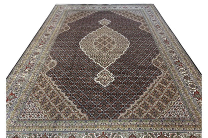 Indo Tabriz rug, full view with a large medallion and richly ornamented border