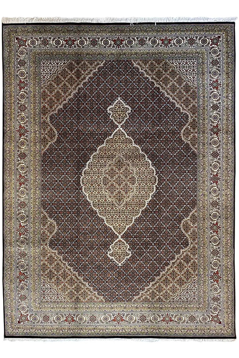 Indo Tabriz rug with a dark central field and light diamond and medallion ornaments