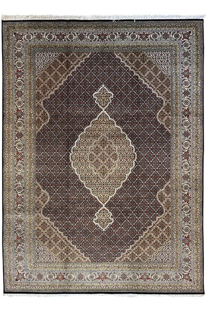 Indo Tabriz rug with a dark central field and light diamond and medallion ornaments