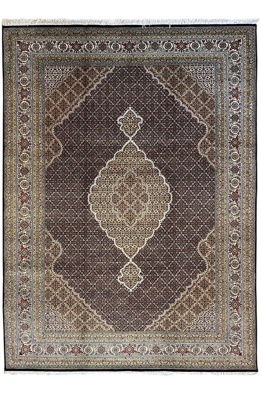 Indo Tabriz rug with a dark central field and light diamond and medallion ornaments