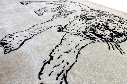 Designer rug: Close-up of dog figure motif in black on a light gray background
