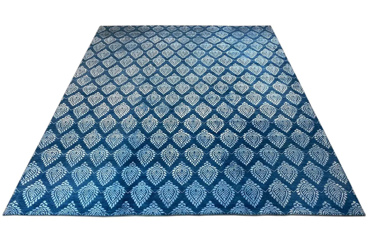 Designer rug with a rectangular area and blue decorative pattern, highlighted in light tones