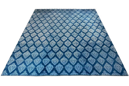 Designer rug with a rectangular area and blue decorative pattern, highlighted in light tones