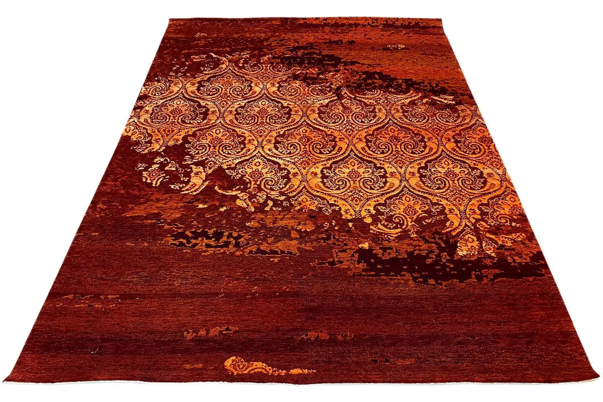 Rectangular rug with a burgundy background and ornate paisley pattern