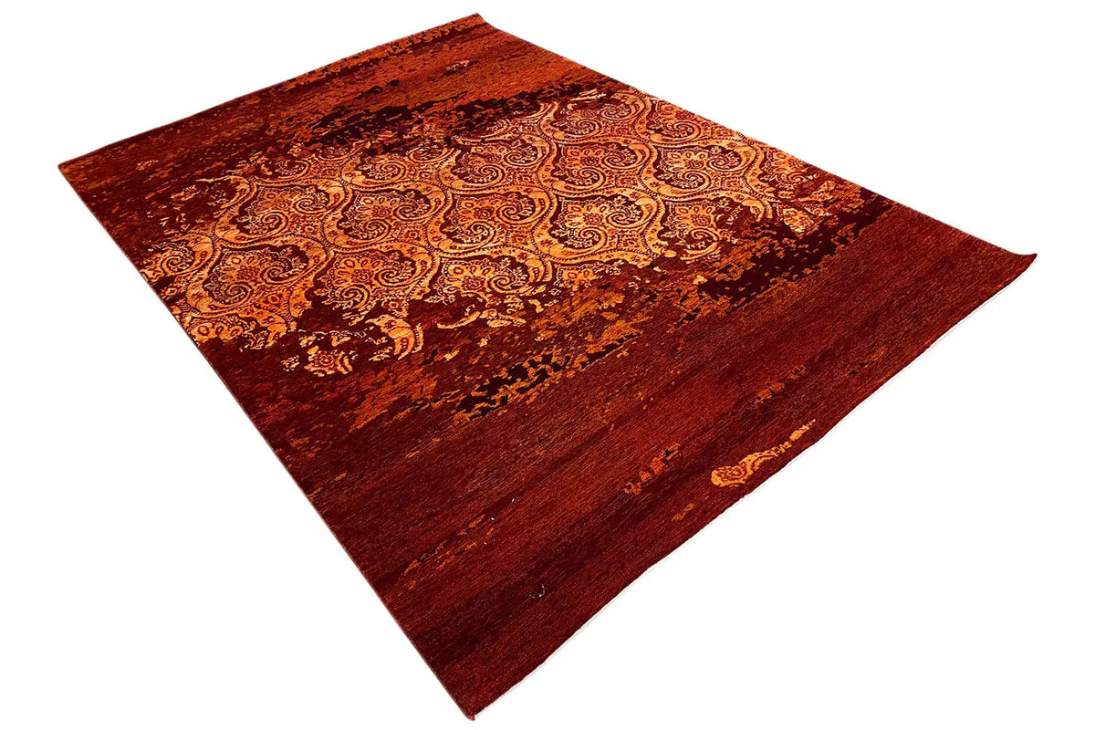 Carpet in burgundy with gold ornaments, draped diagonally