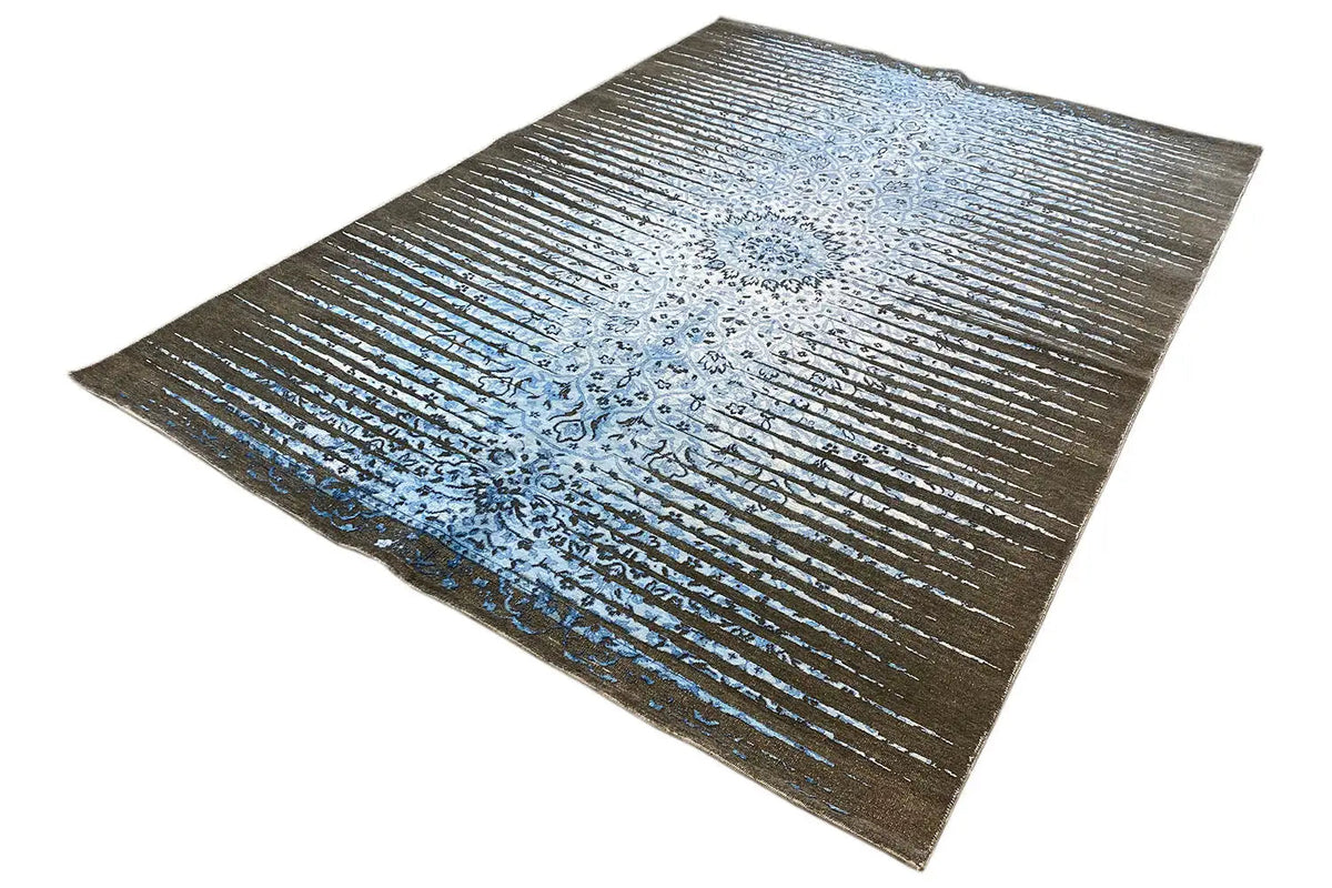 Designer rug with a central ornament in blue, brown background, and even stripes