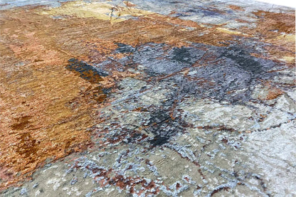 Close-up of a designer rug with a coarse, textured surface in brown, blue, and gray