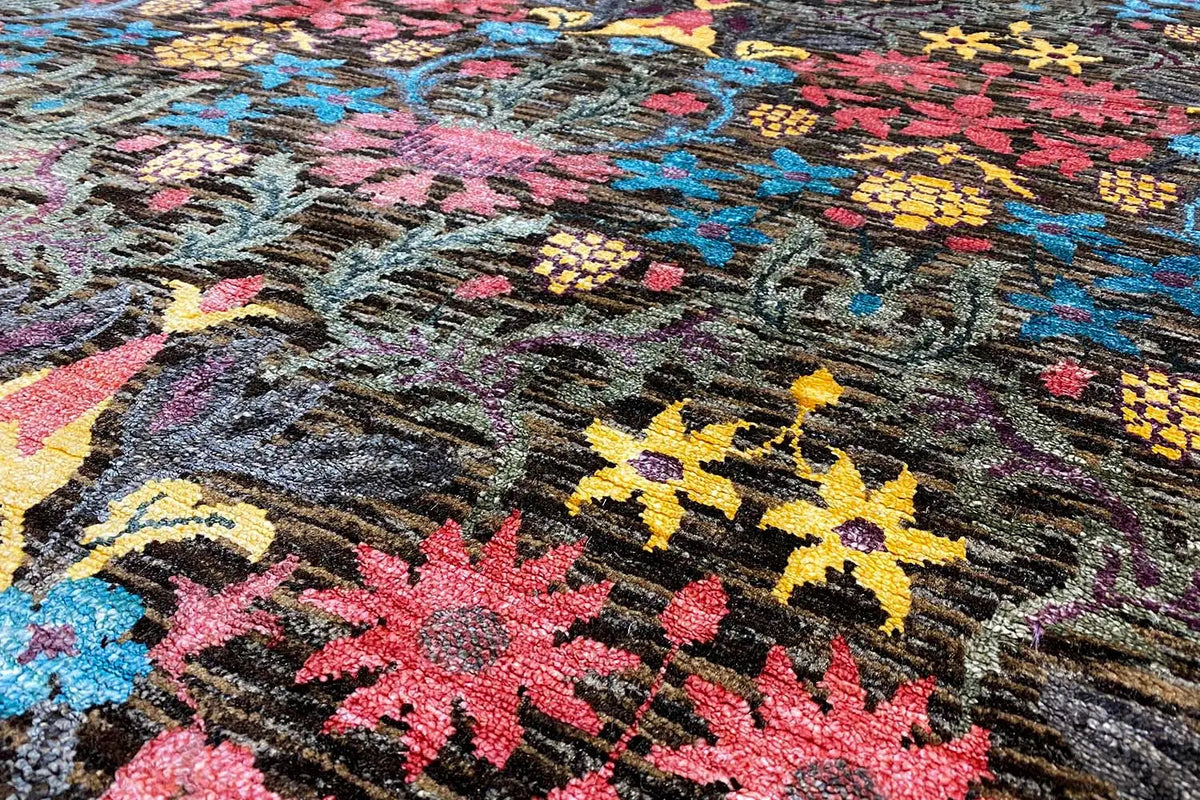 Designer rug detail: high pile with colorful, star-shaped and floral embroidered patterns