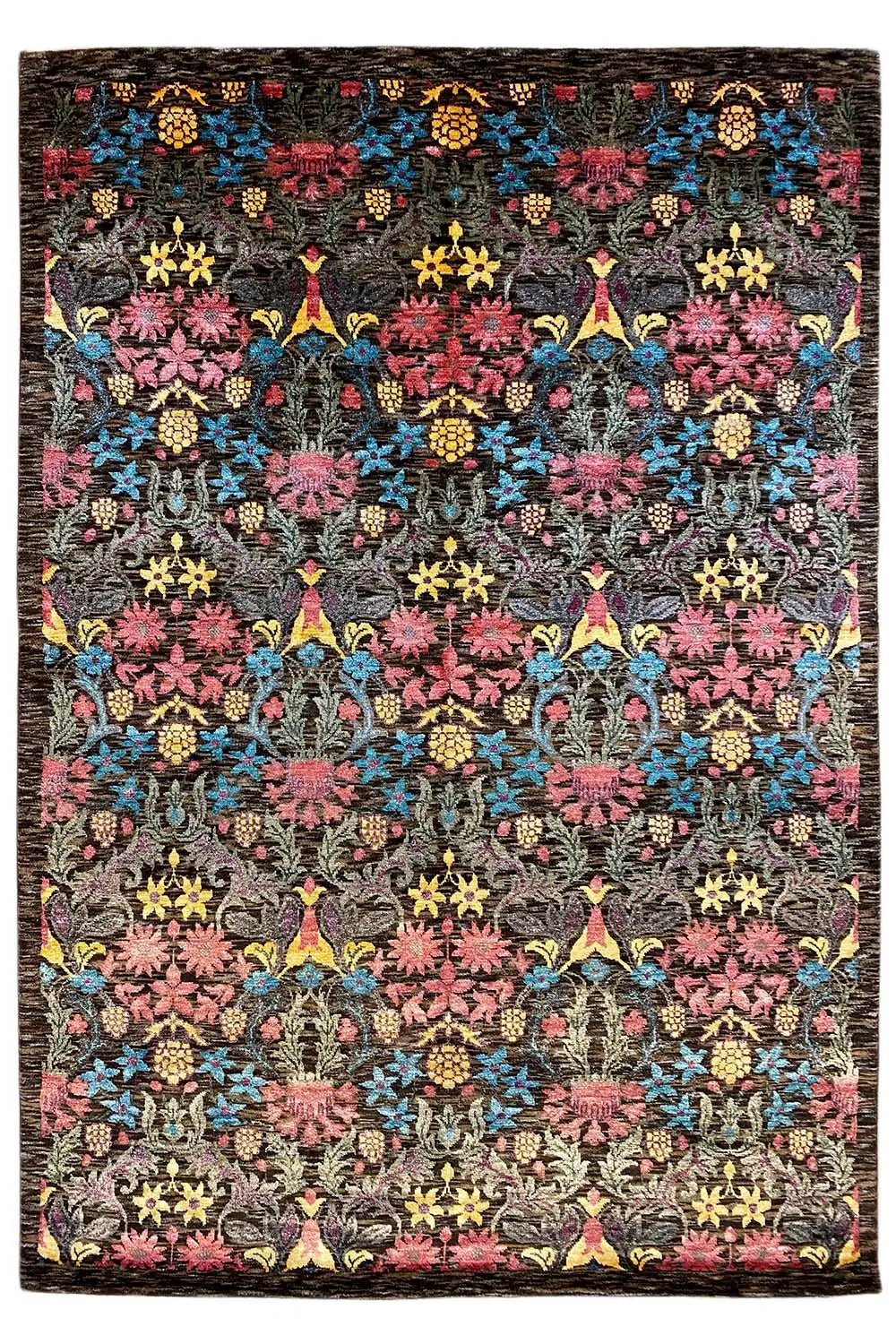 Designer rug with a black background and a colorful ornamental pattern of flowers and stars