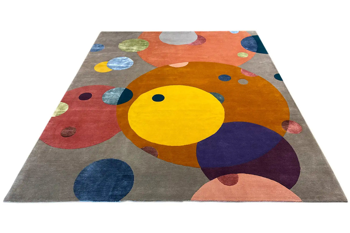 Square rug with a colorful dot design on a gray background
