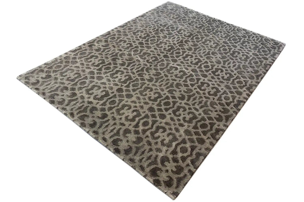 Designer rug with a uniform animal pattern and bound edge, gray-brown