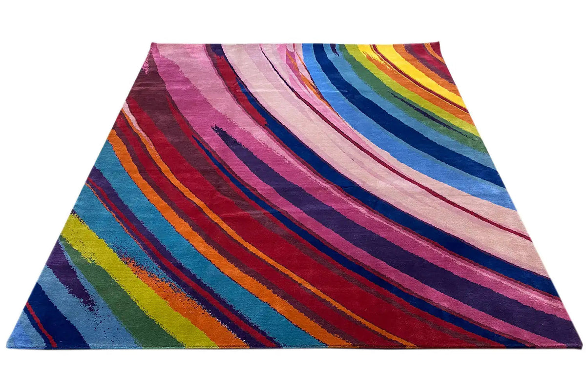 Rainbow-striped rug, spread out in a V shape with a colorful spectrum