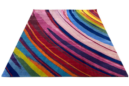 Rainbow-striped rug, spread out in a V shape with a colorful spectrum