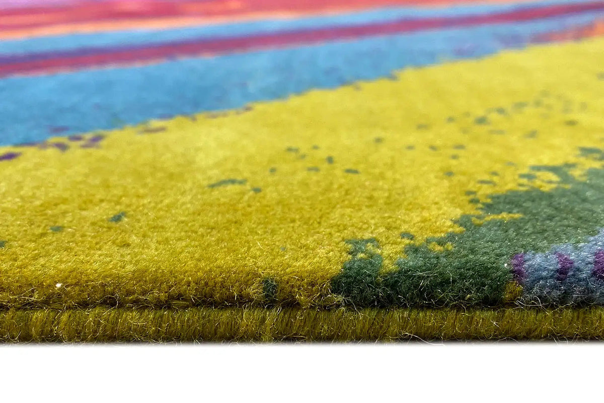 Carpet detail: yellow-green pile pattern with colorful accents along the edge
