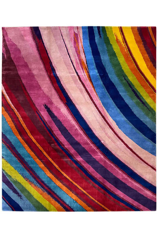 Striped rug in detail: wide bands of color in pink, blue, and yellow
