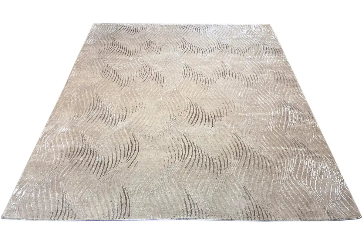 Pascal Walter “Waves” rug: beige rectangular rug with a wave embossing in the pattern