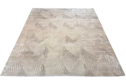 Pascal Walter “Waves” rug: beige rectangular rug with a wave embossing in the pattern