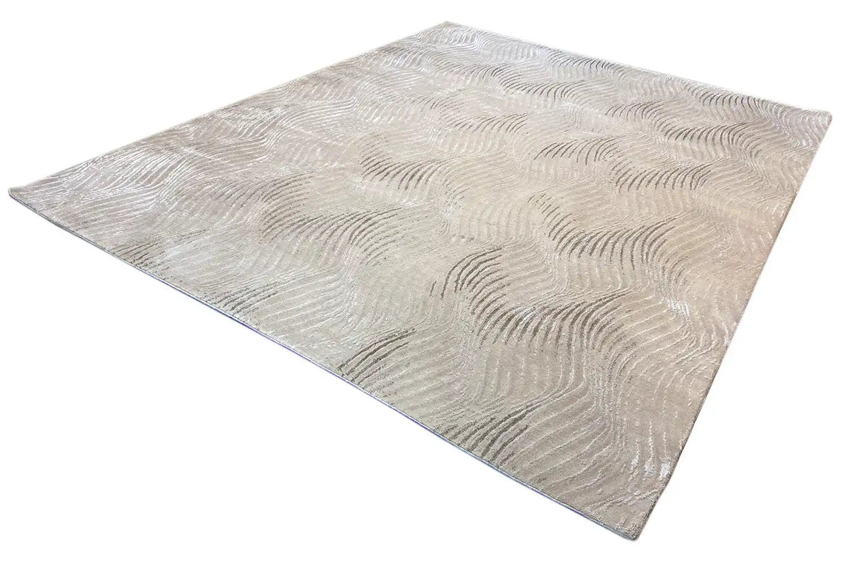 Pascal Walter “Waves” rug: beige rectangular rug with a uniform wave texture