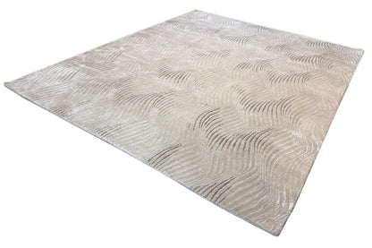 Pascal Walter “Waves” rug: beige rectangular rug with a uniform wave texture