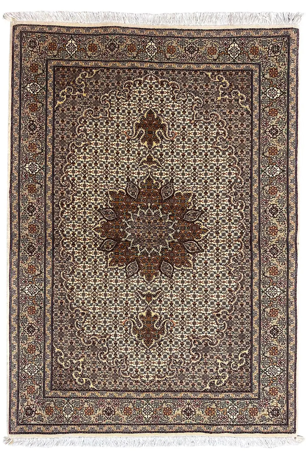 Rug with a central floral pattern, brown border, and beige background, with fringes