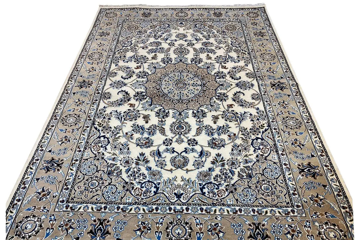 Large rug with a cream-beige base, blue Baroque pattern, and medallion