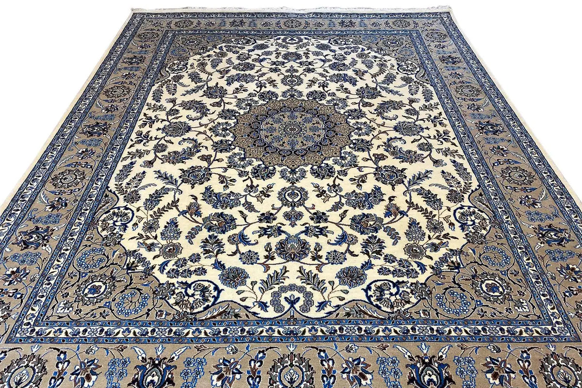 Top view of a rug: cream background with a blue floral and vine ornament