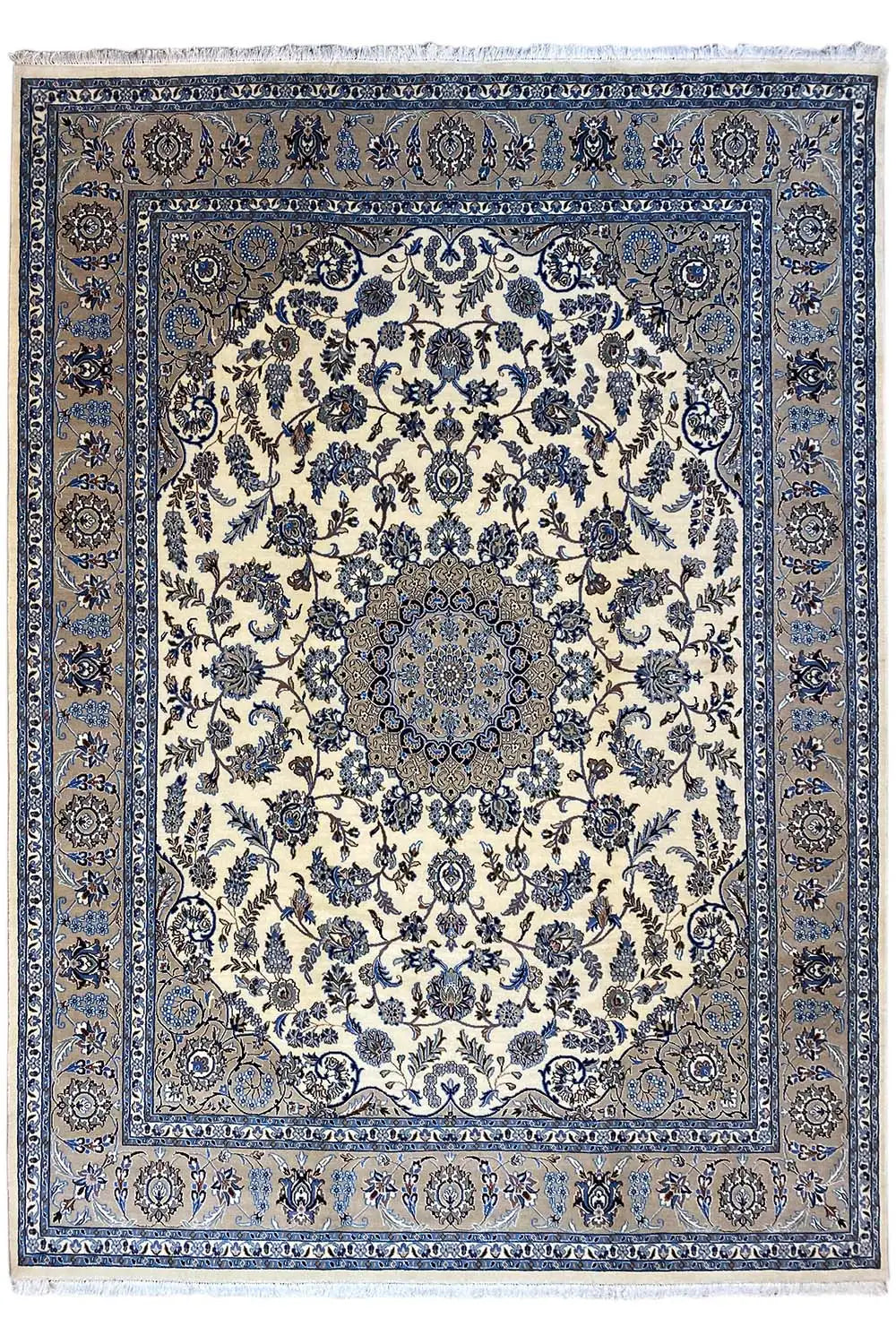 Large Oriental rug with a cream-colored field, blue border, and delicate pattern