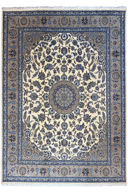 Large Oriental rug with a cream-colored field, blue border, and delicate pattern
