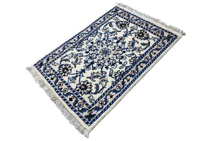 Blue and white rectangular Nain rug, dense ornamental pattern, fringes