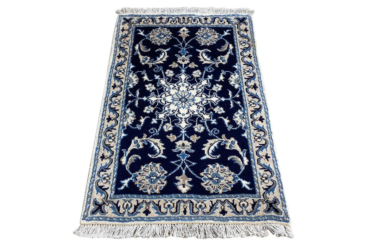 Nain rug, dark blue with medallion pattern and light blue border, fringes