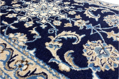 Close-up of a Nain rug, dark blue ornamental pattern with light embellishments