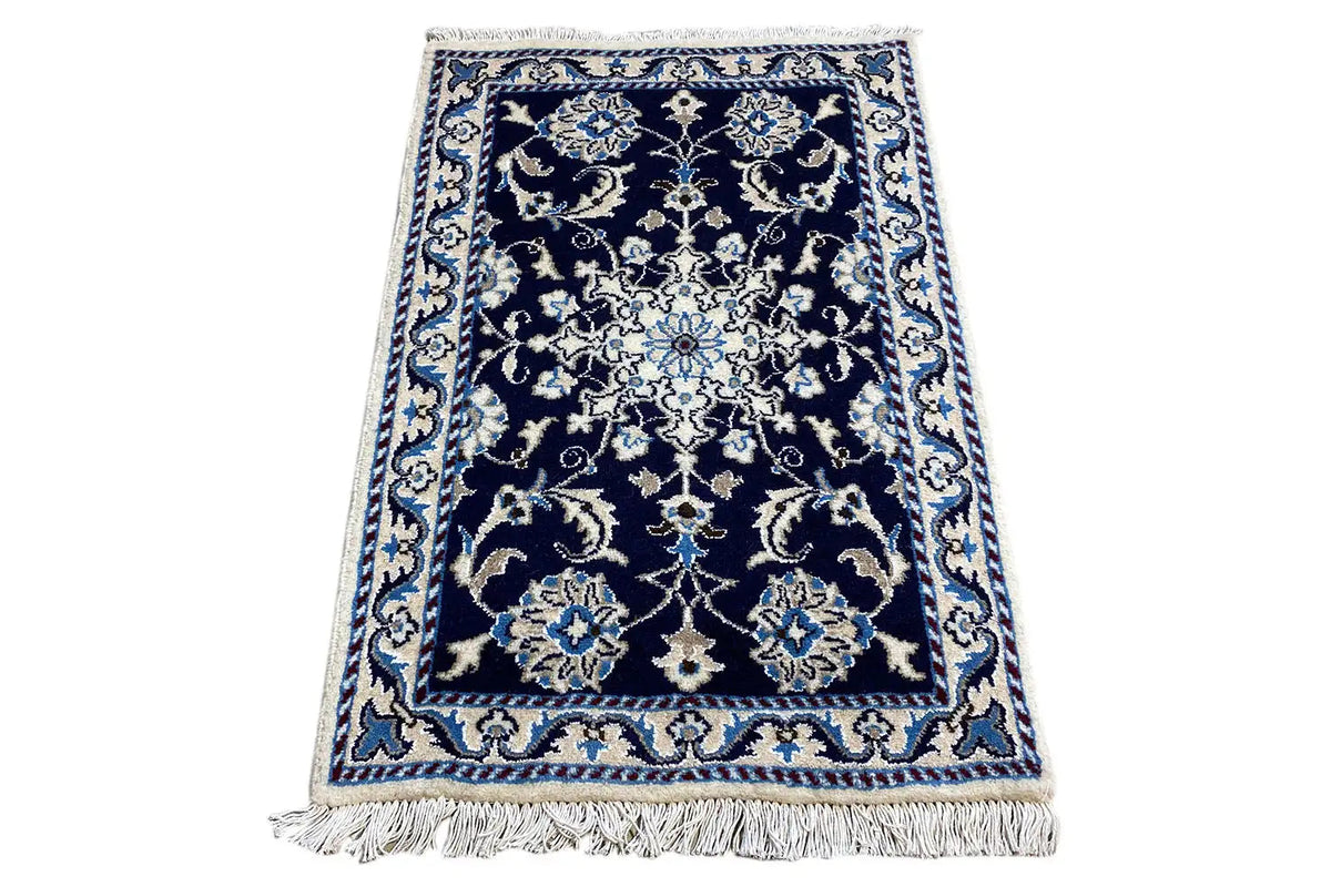 Rug 88x60 cm, dark blue with an ornamental pattern in beige and light blue, fringes