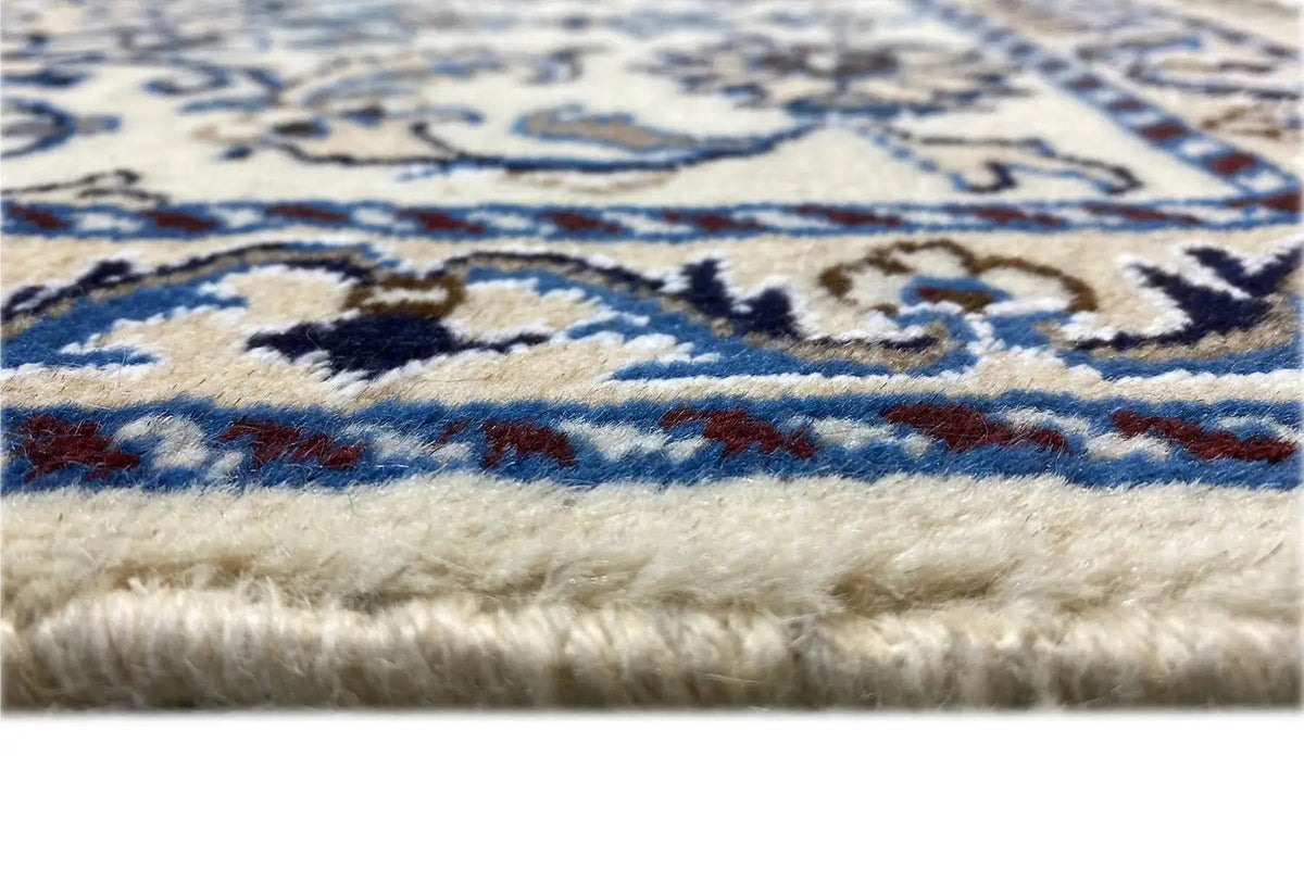 Nain rug edge with fringes, blue pattern on a light background (detail)